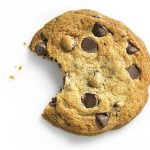 Chocolate Chip Cookie with bite on white